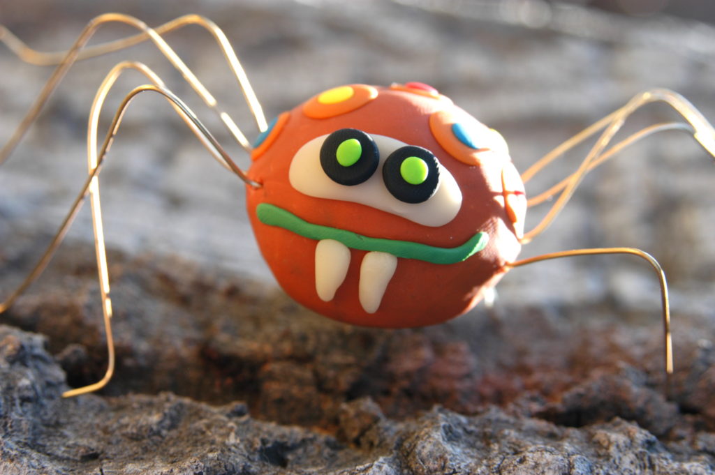 A silly looking insect made from clay.