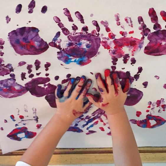 Pint-sized handprints made in tempera paint