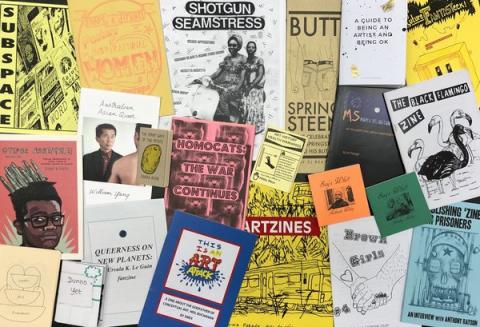 A photograph of a collection of zines.