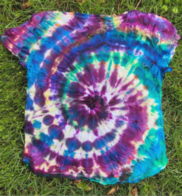 A photo of a tie-dyed t-shirt.