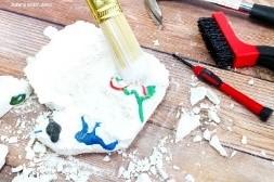 A photo of plastic dinosaurs encased in plaster of Paris