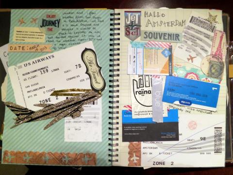 A picture of a smash book, which is a notebook filled with mementos of traveling like boarding tickets, business cards, and notes.