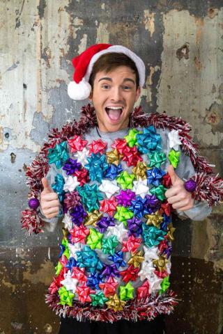 Picture of a teen wearing a sweater with gift bows. 