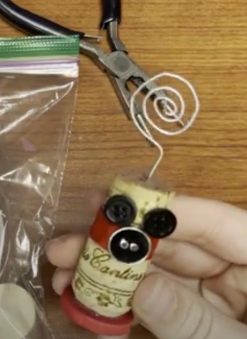 A picture of a cork photo holder, this one in the style of Micky Mouse.