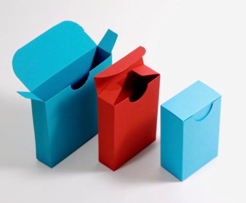 One big, one medium, and one small paper box for playing cards..