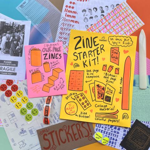 A picture of zines and supplies for making zines.