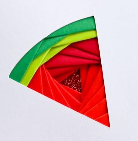 Picture of an iris folding technique shaped like a watermelon. 