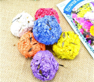 A picture of colorful seed bombs, ready to plant.