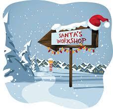 Santa's Workshop sign in a snowy landscape