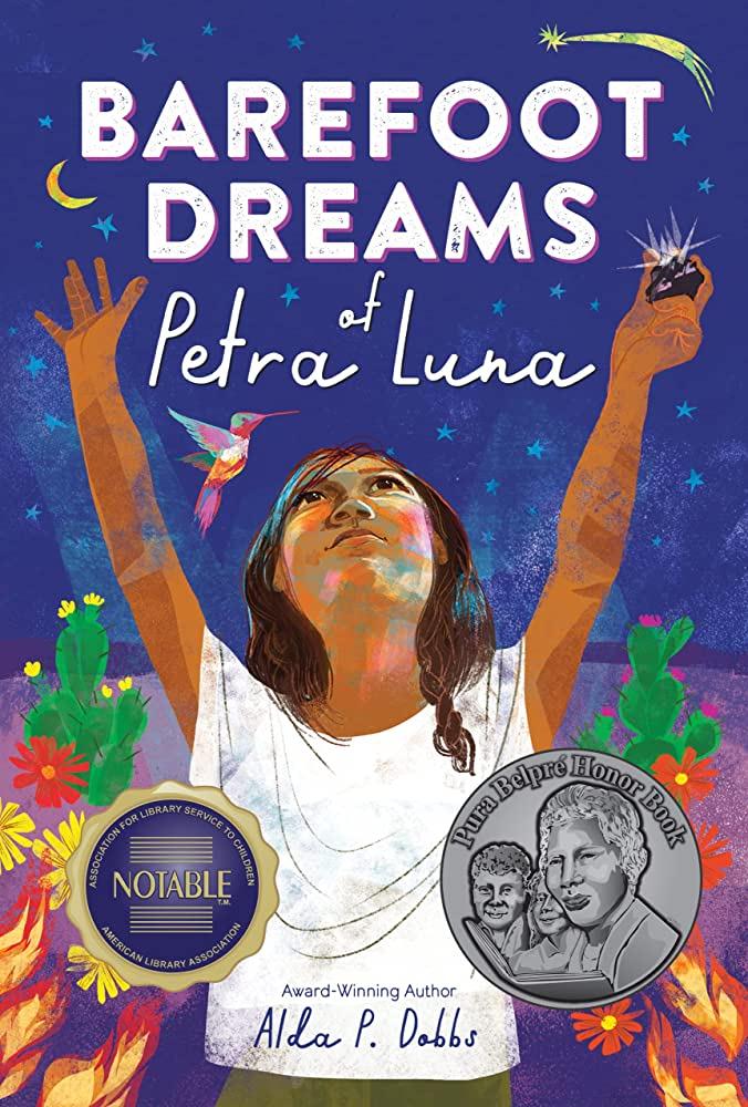 The cover of "Barefoot Dreams of Petra Luna" by Alda P. Dobbs, featuring a young Mexican girl holding her arms up to the night sky, outside in a desert. 