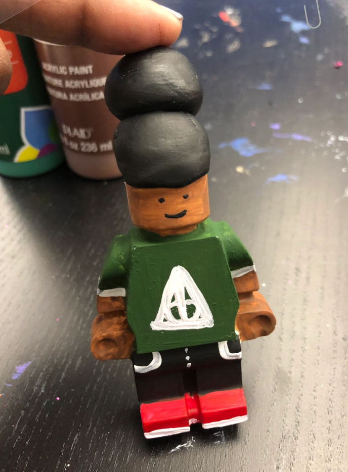 Picture of a LEGO person made from resin. 