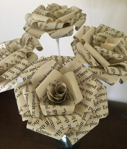 A picture of paper roses made out of book pages.