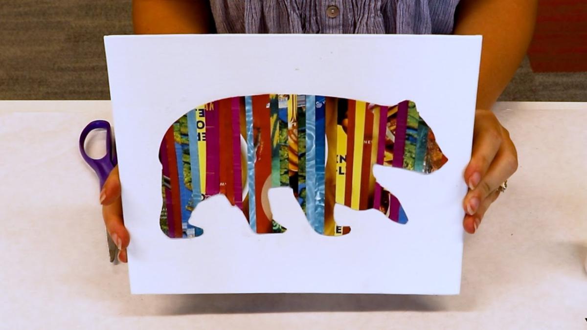 A picture of a bear created with strips of magazine. 